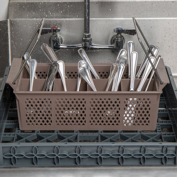 A brown Noble Products flatware rack with spoons in it.