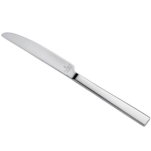 A close-up of a Oneida Chef's Table Mirror stainless steel dinner knife with a silver handle.