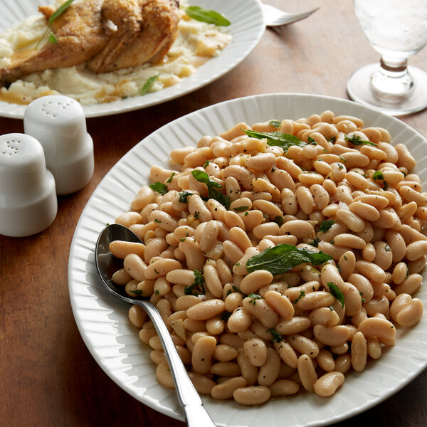 A white plate with Furmano's white kidney beans and herbs on it.