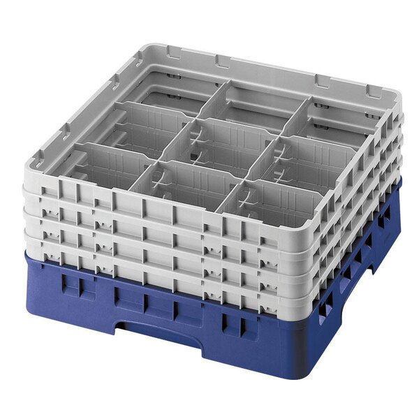 A blue plastic Cambro glass rack with 9 compartments and 2 extenders.