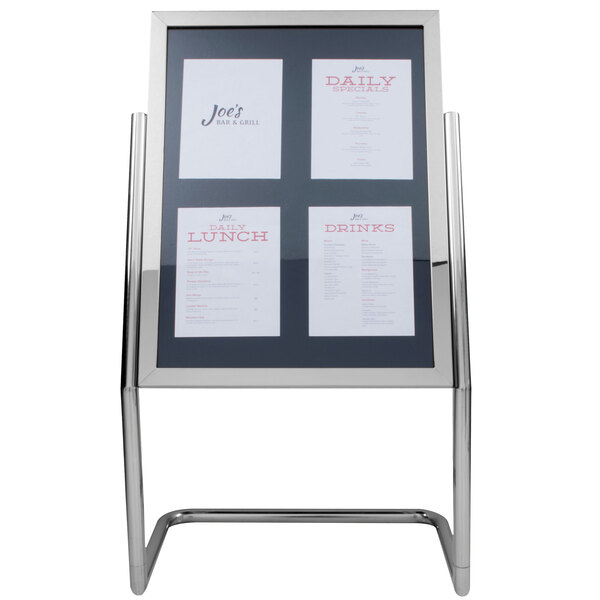 A chrome double pedestal menu board with white paper on it.