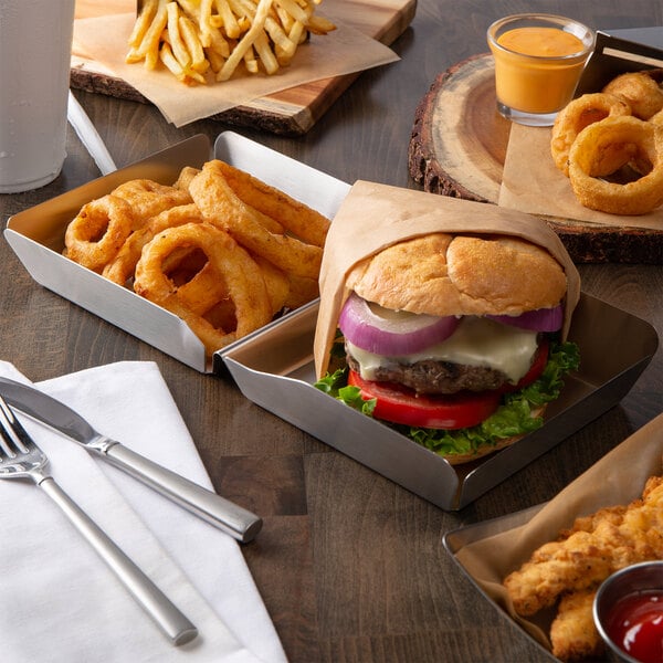 A Tablecraft stainless steel tray holding a burger and fries.