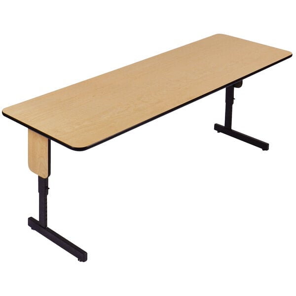 A rectangular wood seminar table with a black base.