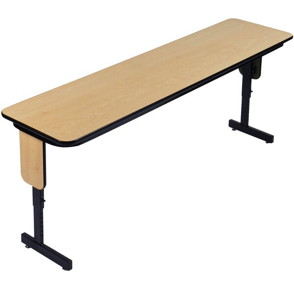 A Correll rectangular Fusion Maple seminar table with black panel legs.