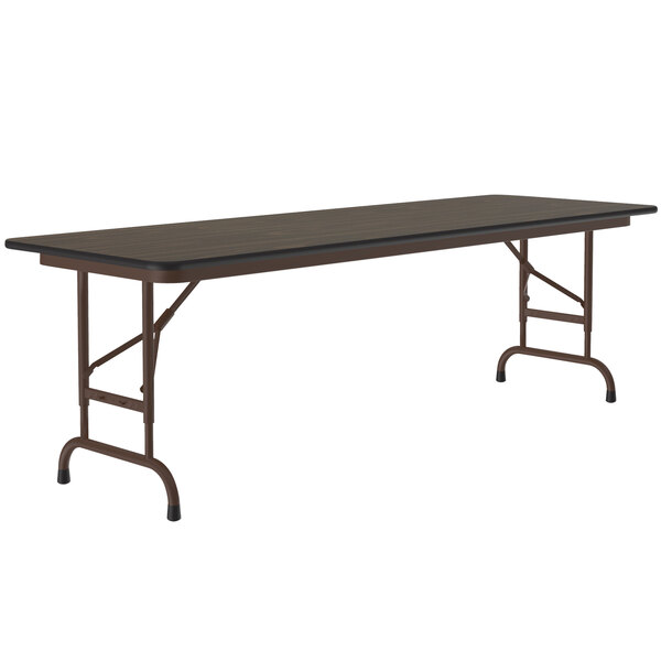 A rectangular Correll folding table with a walnut top and metal frame.