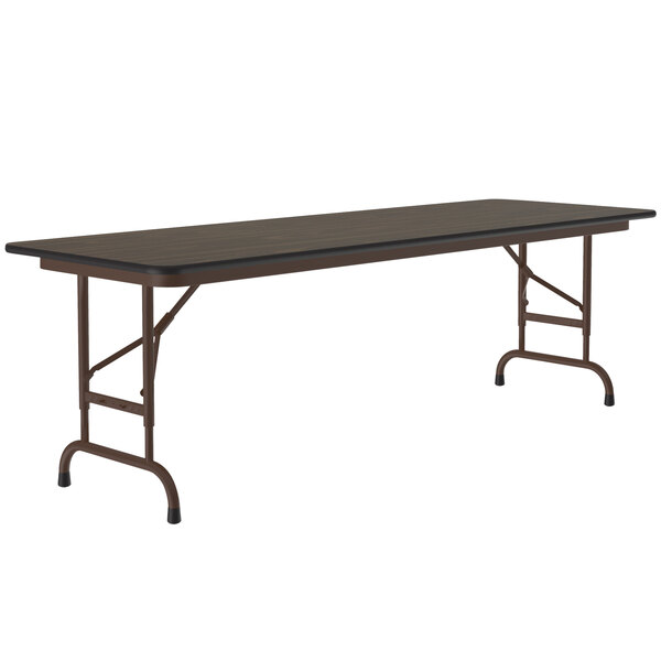 A rectangular walnut folding table with a brown metal frame.