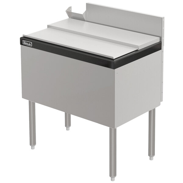 A stainless steel Perlick ice chest with a black top.