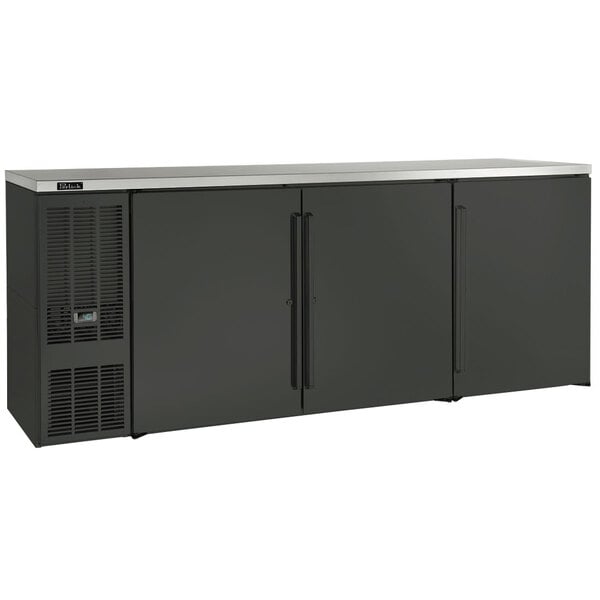 A black Perlick back bar refrigerator with two solid doors and black handles.