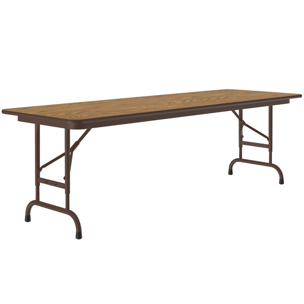 A Correll rectangular folding table with a medium oak top and metal frame.