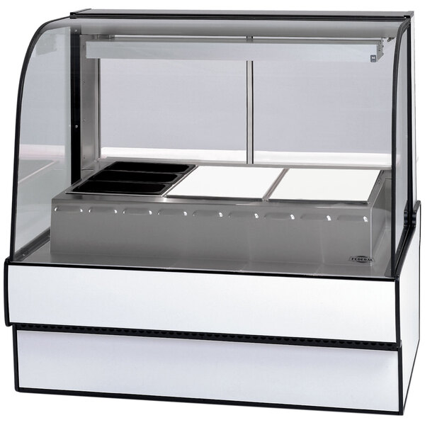 A Federal Industries heated display case with a glass top and curved front on a counter.