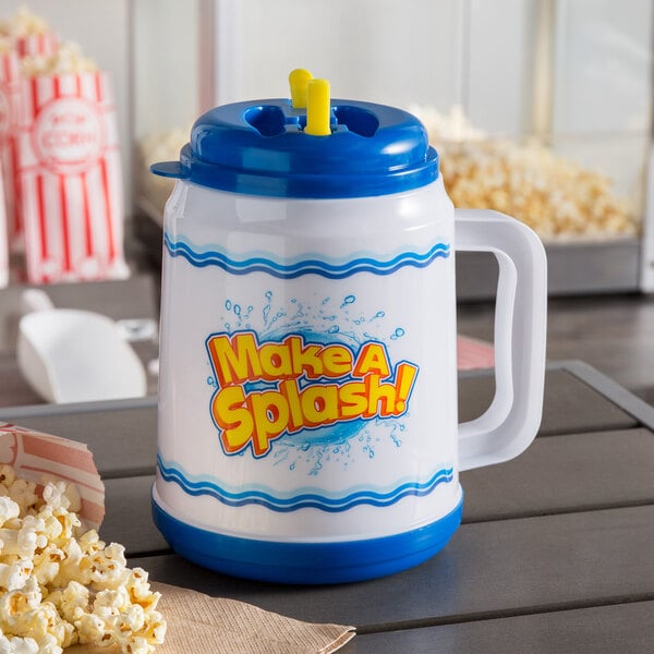 A white and blue plastic cup with a straw and lid with yellow text that says "Make a Splash"