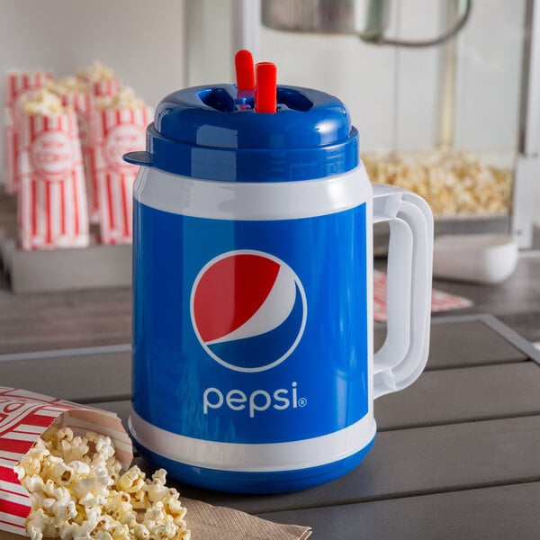 A blue and white Pepsi Tanker with a straw next to popcorn.