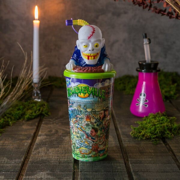 A 32 oz. plastic cup with a cartoon zombie design on it.