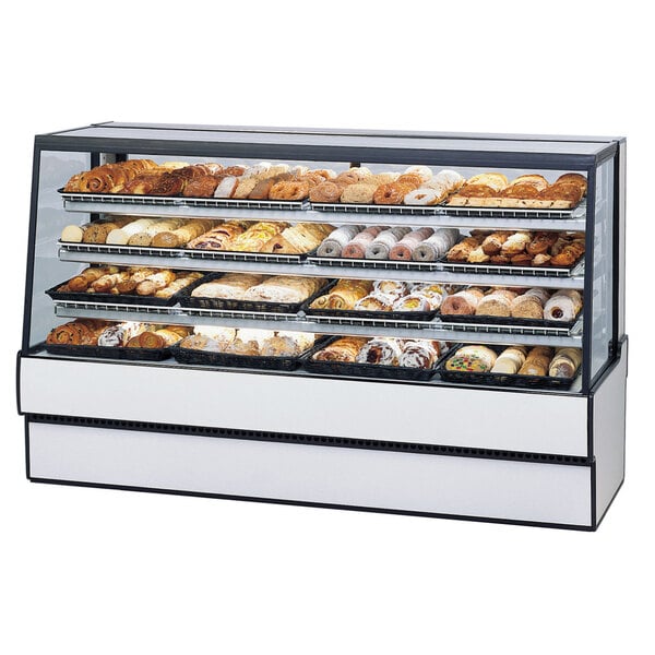 A Federal Industries dry bakery display case filled with various pastries.