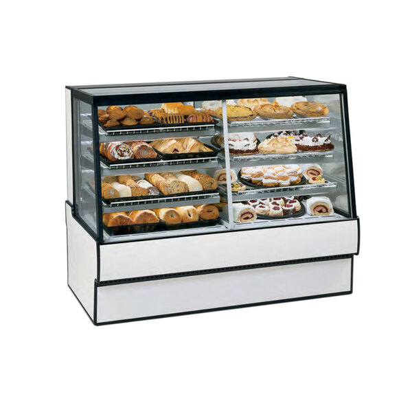 A Federal Industries dual-zone bakery display case with pastries on a counter.