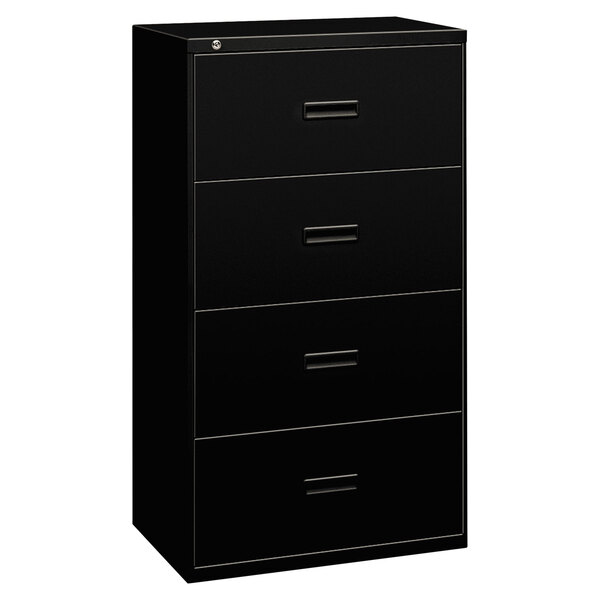 A black Hon file cabinet with four drawers.