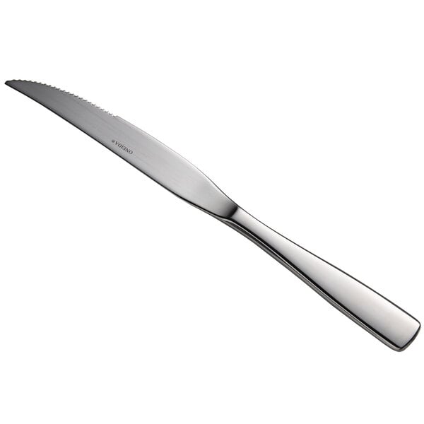 A close-up of a silver Oneida Tidal stainless steel steak knife with a long handle.