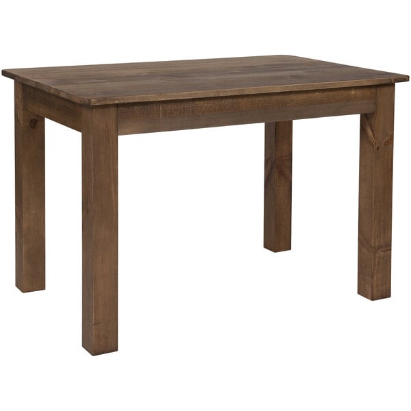 A Flash Furniture Hercules rustic pine farm table with dark brown legs.