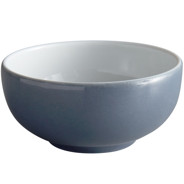 A close-up of a Schonwald Structure Grey porcelain dip bowl with a white rim.