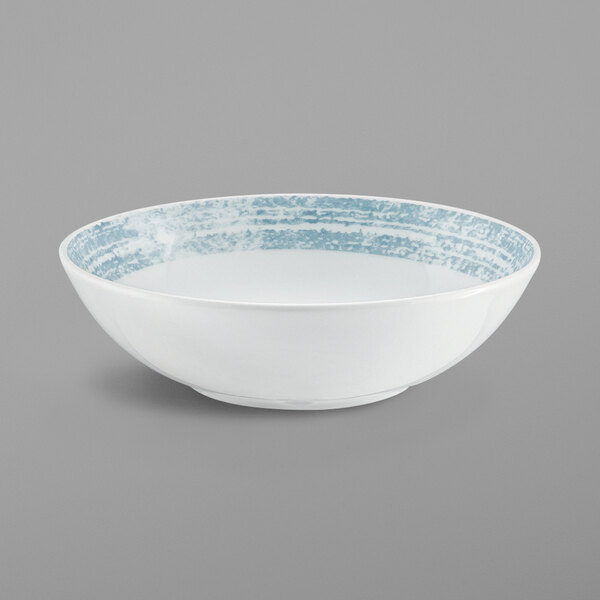 A white Schonwald porcelain bowl with blue stripes on the rim.