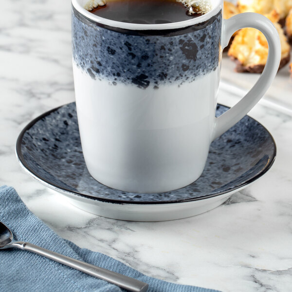 A Schonwald porcelain saucer with a cup of coffee on it.