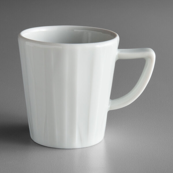 A Schonwald white porcelain espresso cup with a handle.