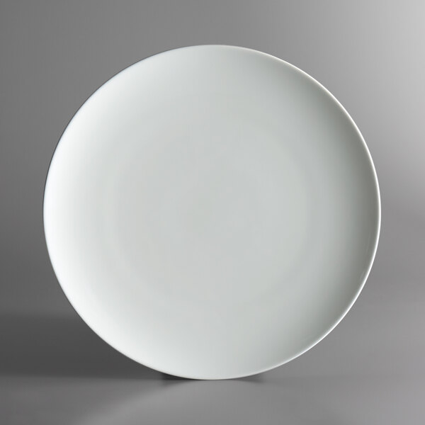 A Schonwald bone white porcelain plate with a round rim.