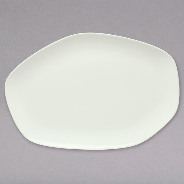 A Schonwald bone white porcelain oblong coupe platter on a gray background.
