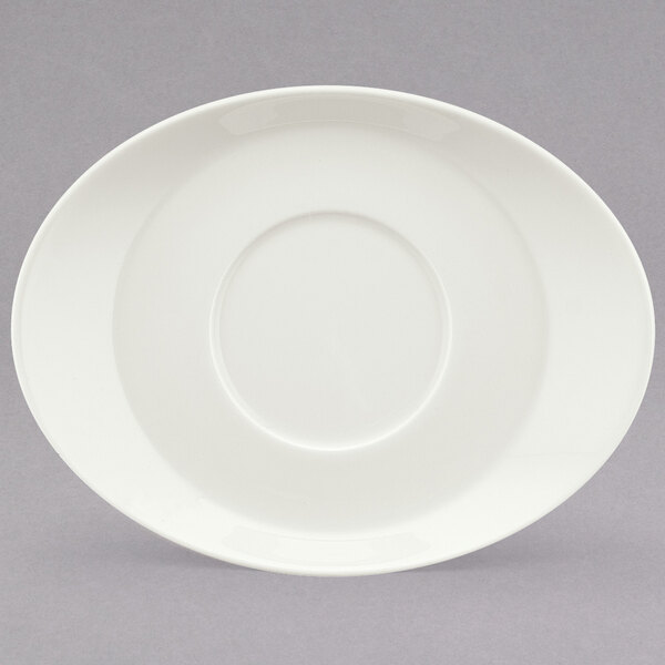 A white oval porcelain saucer with a round edge.