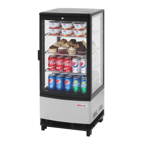 A Turbo Air countertop display refrigerator with drinks and cupcakes.