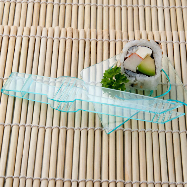 Fineline green plastic tongs serving sushi on a clear plastic tray.