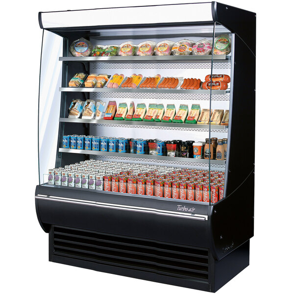 A Turbo Air black refrigerated air curtain merchandiser with food items on shelves.