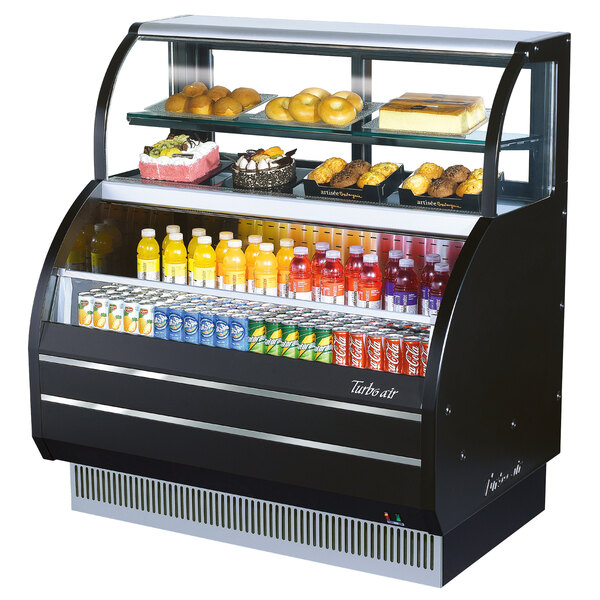A black Turbo Air dual service refrigerated open display case with food and drinks inside.