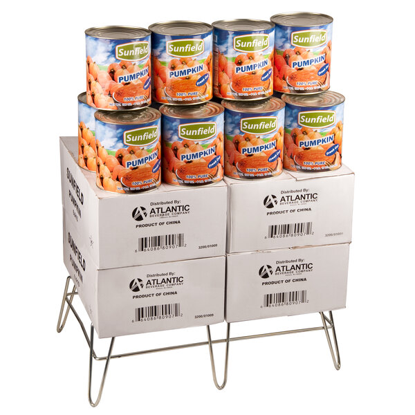 A stack of canned baby food on a Winholt merchandising stand.