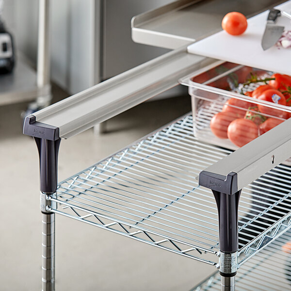 A Metro MS-RS36 Multi-Rail Set on a metal shelf with tomatoes.