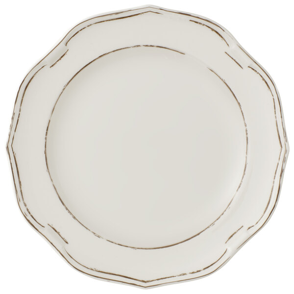 A white Villeroy & Boch premium porcelain coupe plate with a gold rim.