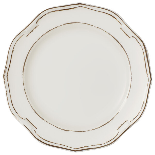 A white Villeroy & Boch porcelain coupe plate with a gold rim.