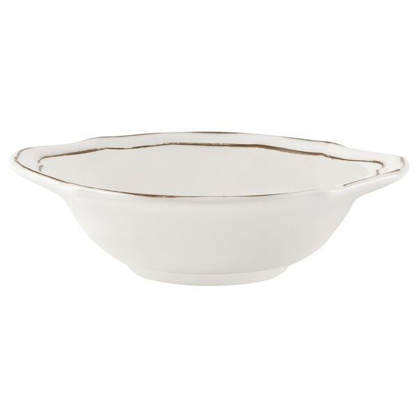 A white Villeroy & Boch porcelain bowl with gold trim.