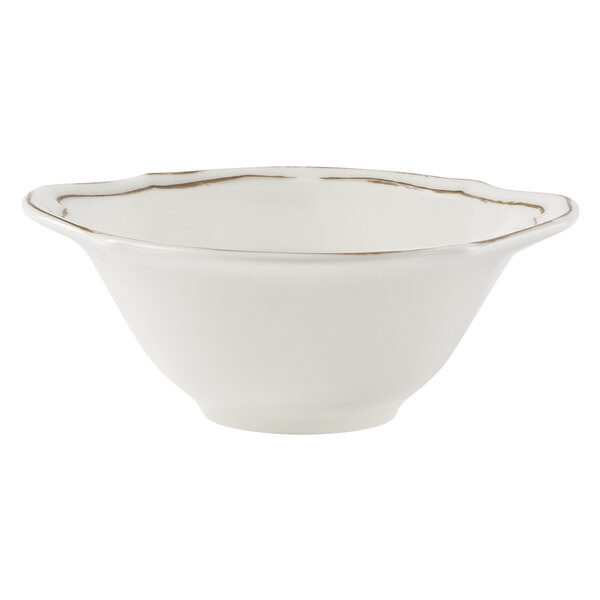 A white Villeroy & Boch porcelain soup cup with gold trim.