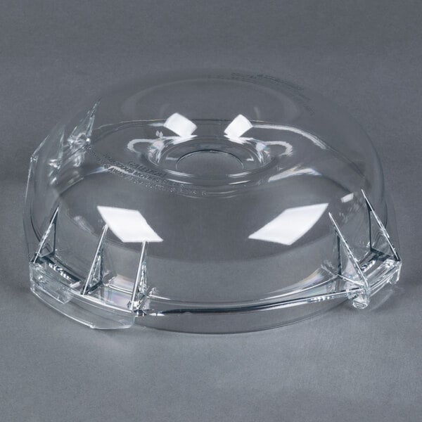 A clear plastic lid with a hole for a Robot Coupe food processor.