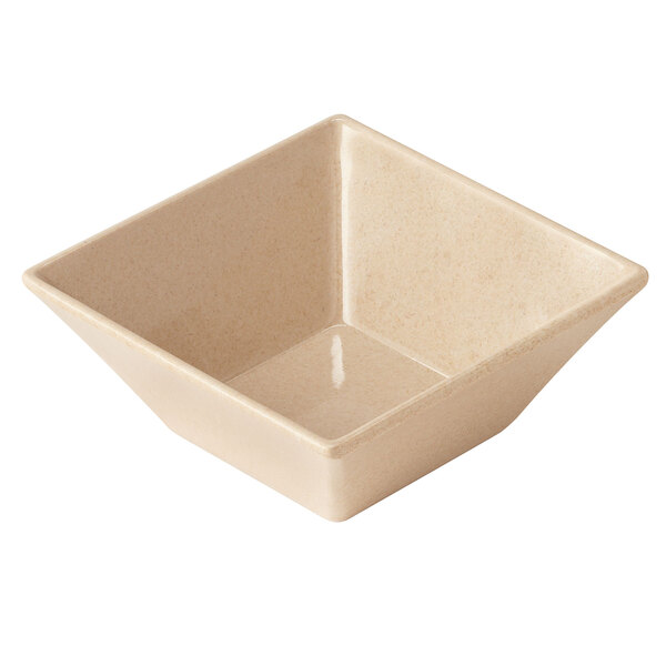 A beige square bowl with a white surface.