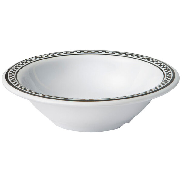 A white melamine bowl with black diamond chexers on the border.