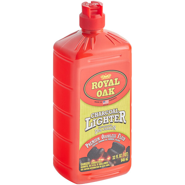 A red plastic container of Royal Oak Charcoal Lighter Fluid with a yellow label.