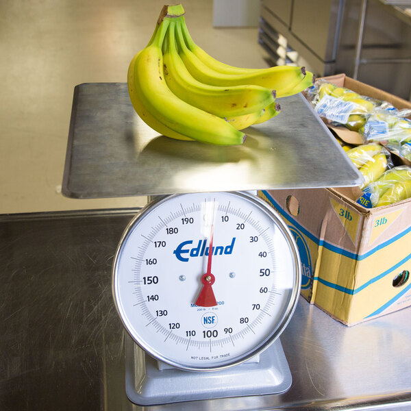 An Edlund heavy-duty receiving scale with a bunch of bananas on it.