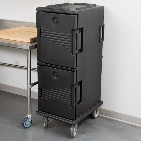 A black Cambro Ultra Camcart food pan carrier on wheels.