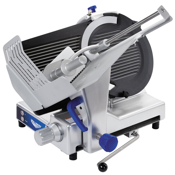 A Vollrath meat slicer with a metal blade and a metal handle.