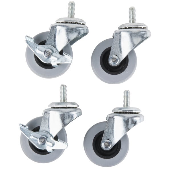 A set of four white Manitowoc swivel casters with rubber wheels.