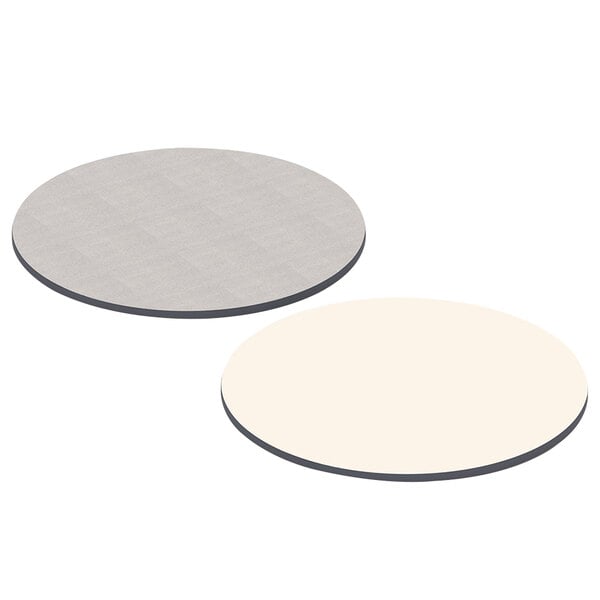 A white circular table top with gray edges.