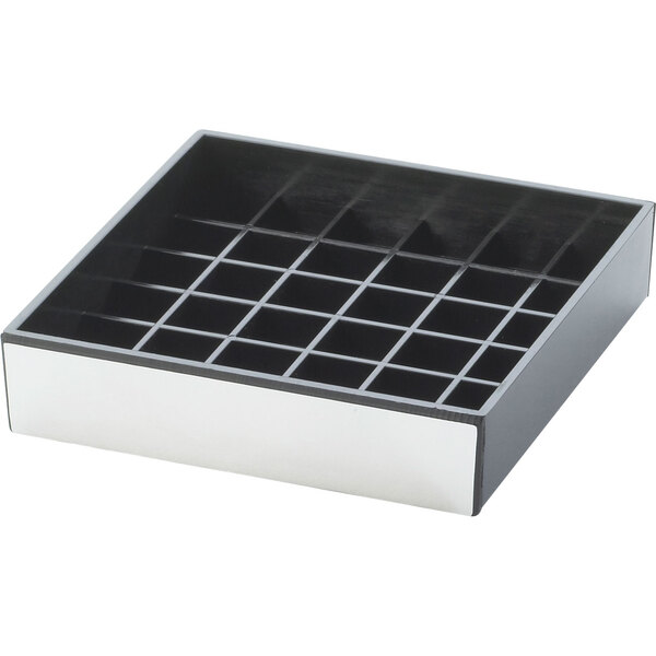 A silver and black square drip tray with many holes.