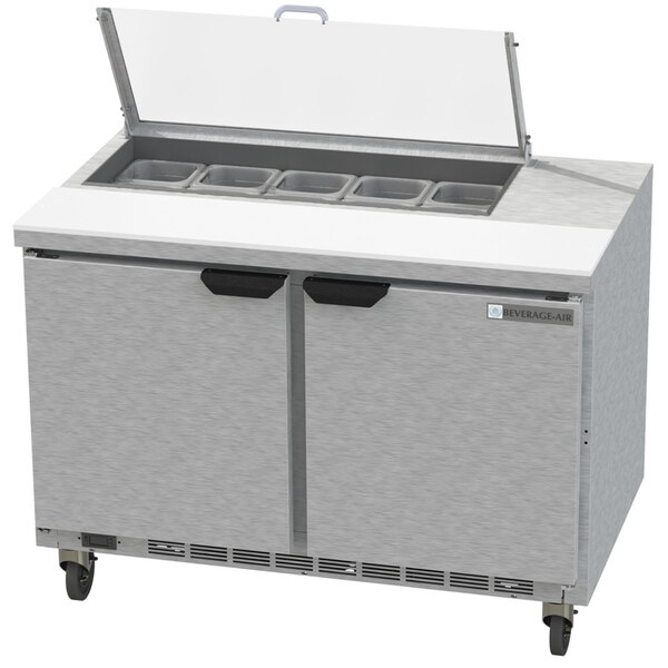 A Beverage-Air stainless steel refrigerated sandwich prep table with two doors and drawers.